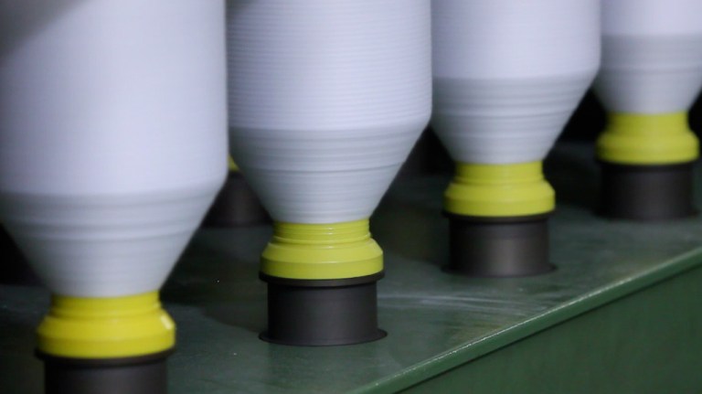 A spool of fabric being created from plastics found in the oceans.