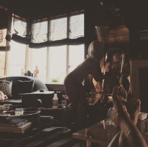 Lady Gaga placing the boots in a display case. Photo: @ladygaga/Instagram