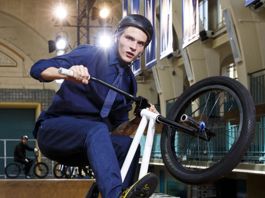 LONDON, ENGLAND - JUNE 15:  A model rides a BMX during the Jimmy Choo presentation during The London Collections Men SS16 at Seymour Liesure Centre on June 15, 2015 in London, England.  (Photo by Tristan Fewings/Getty Images)